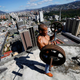 A resident lifts weights on the 28th floor of Torre Silva